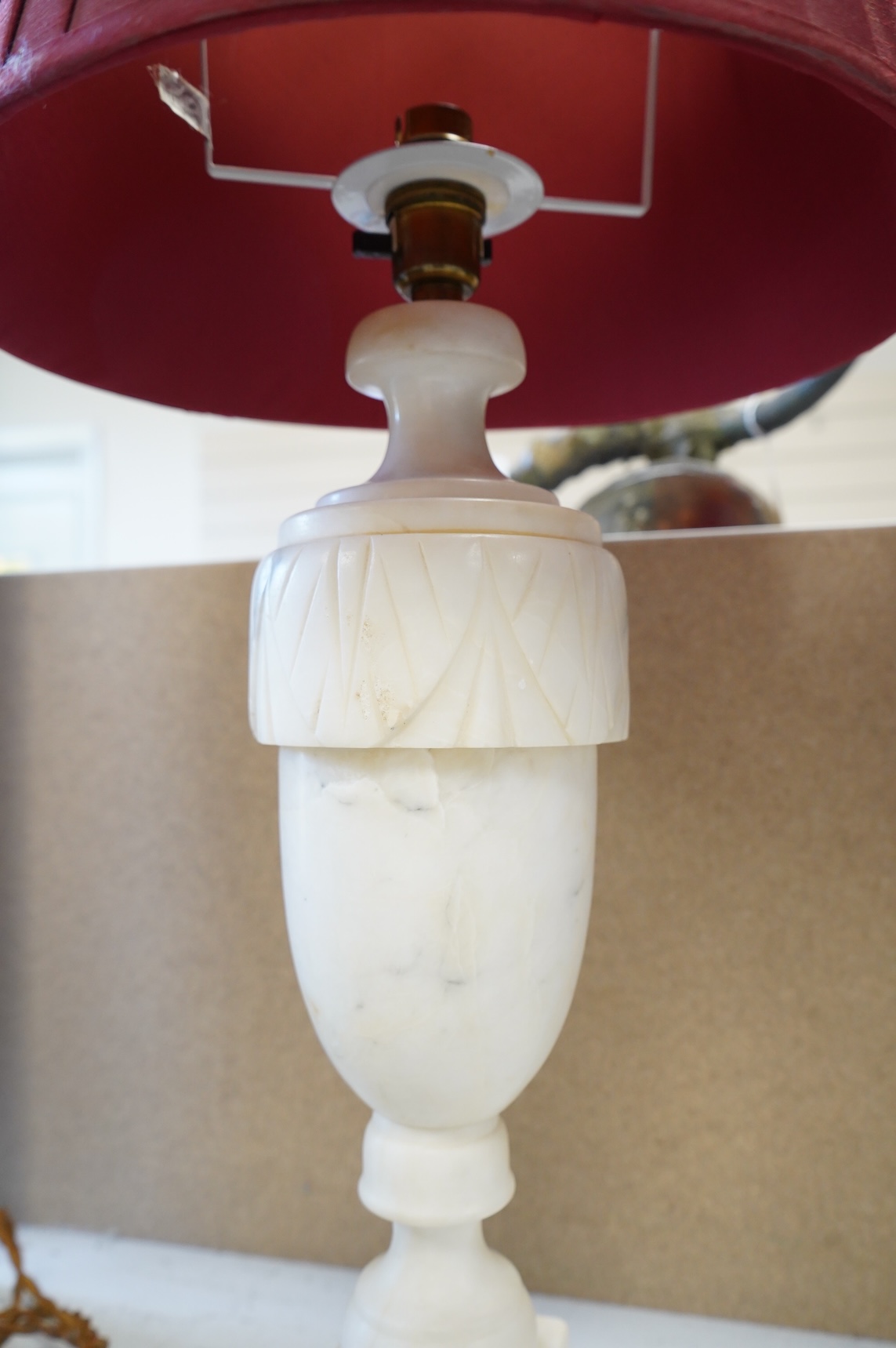 A pair of alabaster table lamps and shades, 56cm total